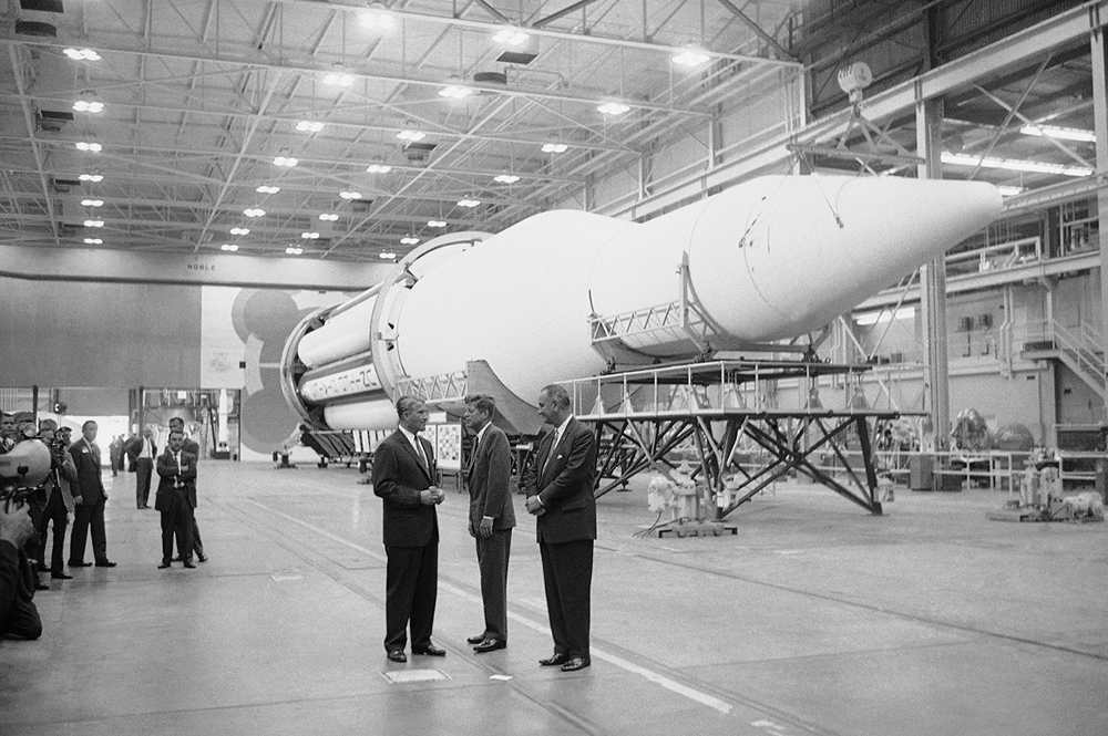 Dr. Wernher von Braun, left, briefs President John Kennedy, center, and Vice President Lyndon Johnson at the assembly plant of the huge Saturn rocket on Sept. 11, 1962 at Huntsville, Alabama. (AP Photo)